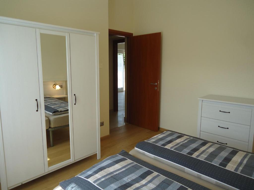 Postel nebo postele na pokoji v ubytování Villa Ninfea
