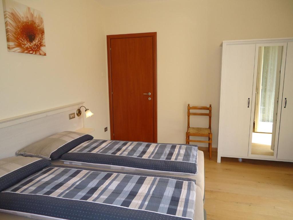 Postel nebo postele na pokoji v ubytování Villa Ninfea