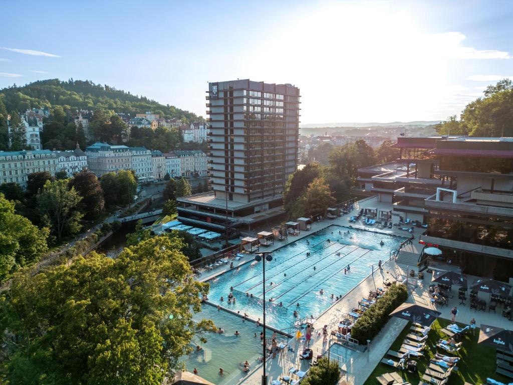 an overhead view of a large swimming pool in a city at Hotel Thermal in Karlovy Vary