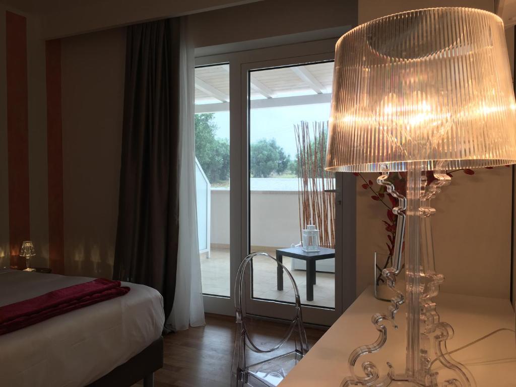 Postel nebo postele na pokoji v ubytování Carone Suite-Charme&Pool
