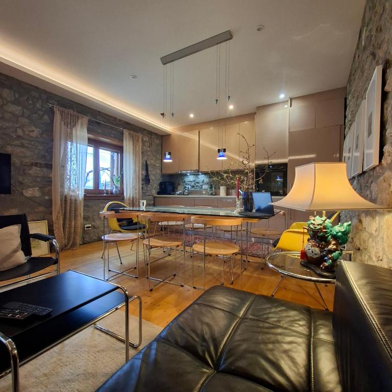 a living room with a couch and a table at 7 Roots - Leskovik in Leskovik