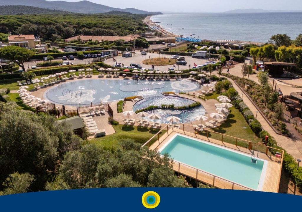 an aerial view of a resort with a swimming pool at Club del Sole Stella del Mare Family Collection in Castiglione della Pescaia