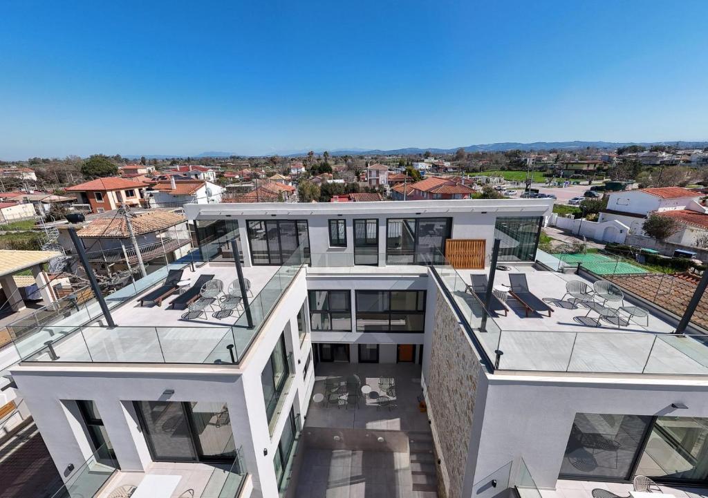 an aerial view of a building with a glass roof at Aetheria South in Kourouta