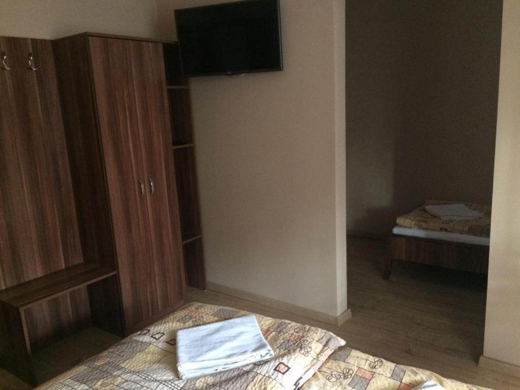 Postel nebo postele na pokoji v ubytování Rózsakert Panzió