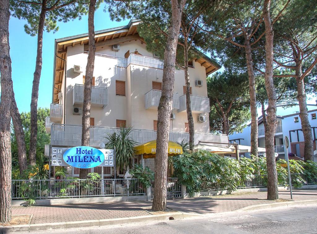 a building with a sign in front of it at Hotel Milena in Cervia