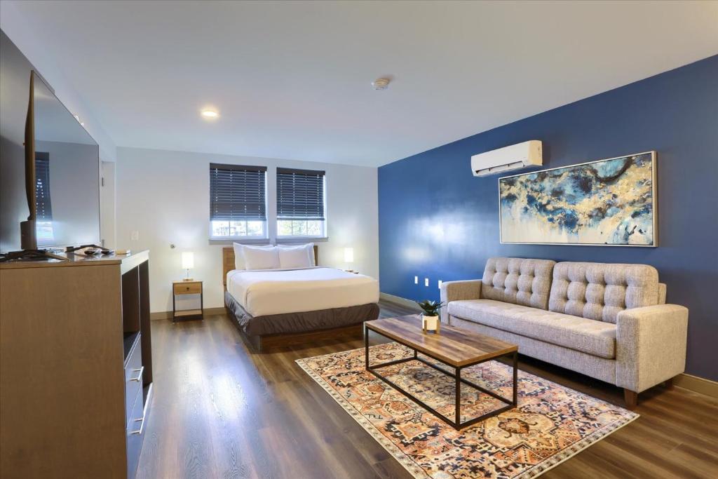 a living room with a bed and a couch at Sweet Stay in Hershey