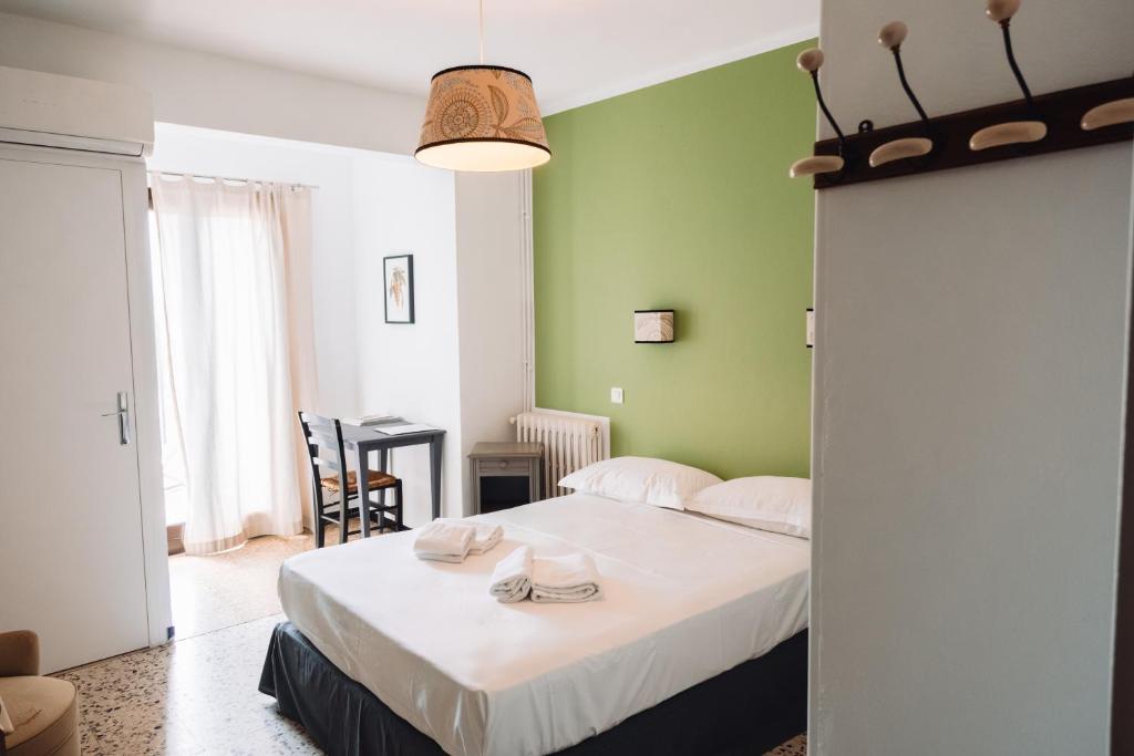 a bedroom with a bed with towels on it at Chez Marie in Linguizzetta