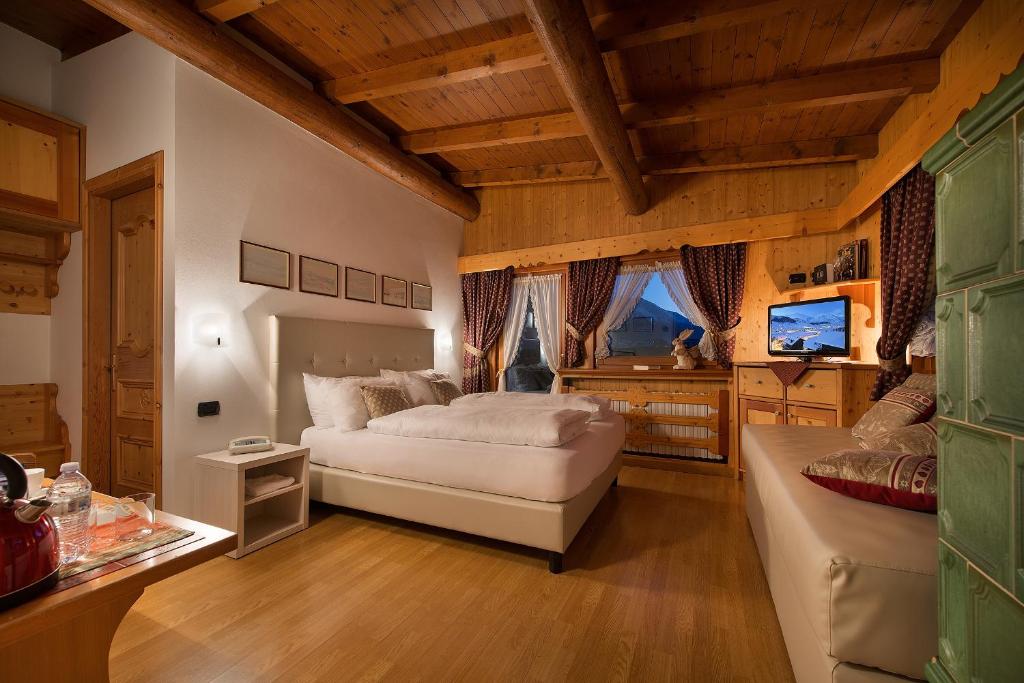 Postel nebo postele na pokoji v ubytování Hotel Posta