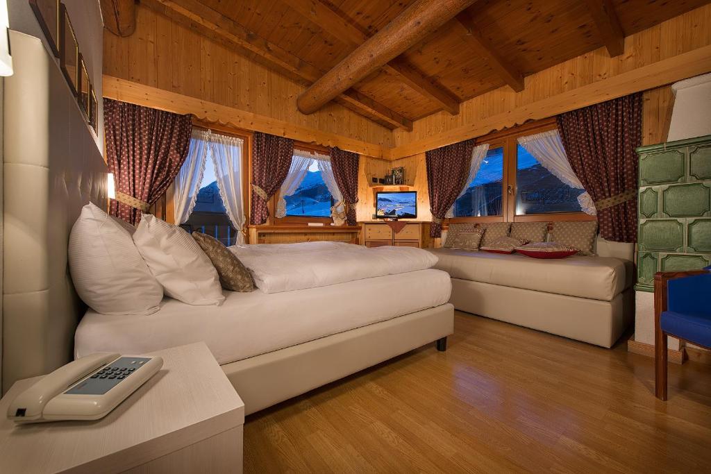 Postel nebo postele na pokoji v ubytování Hotel Posta