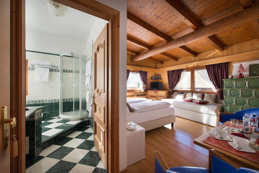 Postel nebo postele na pokoji v ubytování Hotel Posta