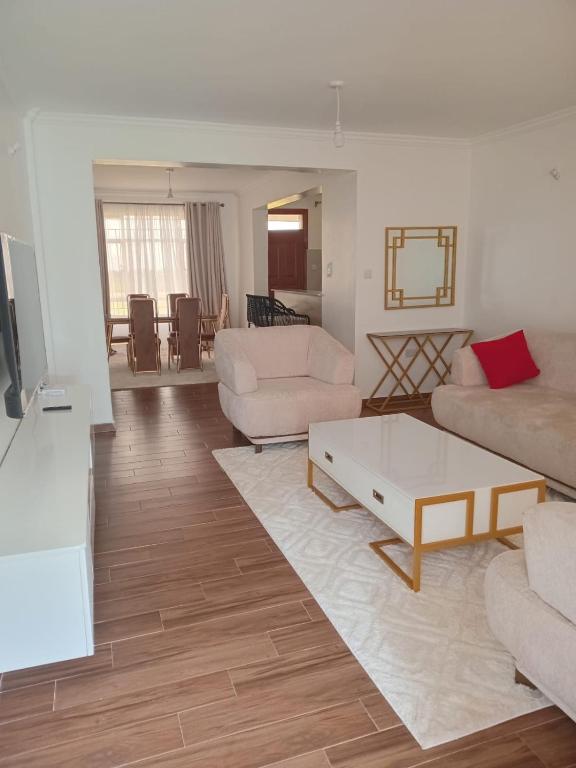 a living room with a couch and a coffee table at Eunas homestay in Eldoret