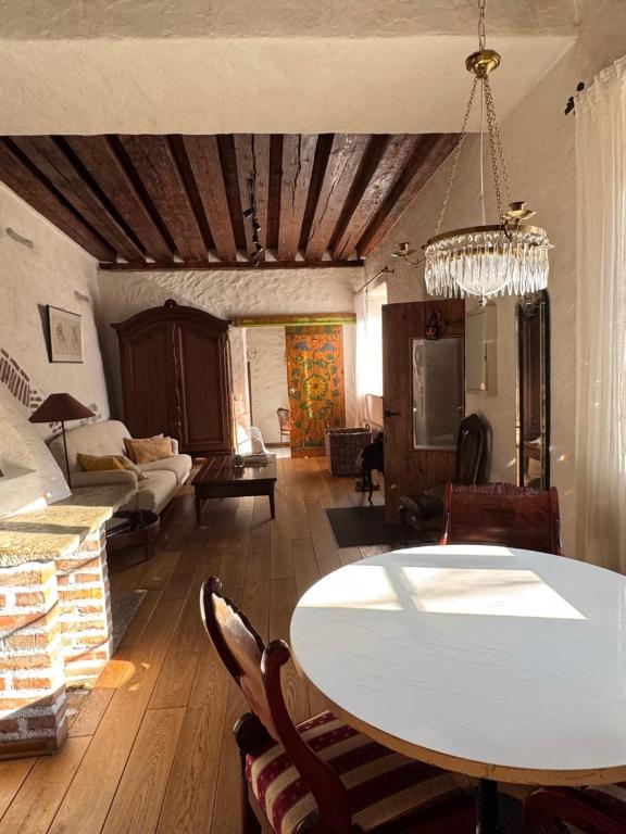 a living room with a table and a couch at Old town gem in Tallinn