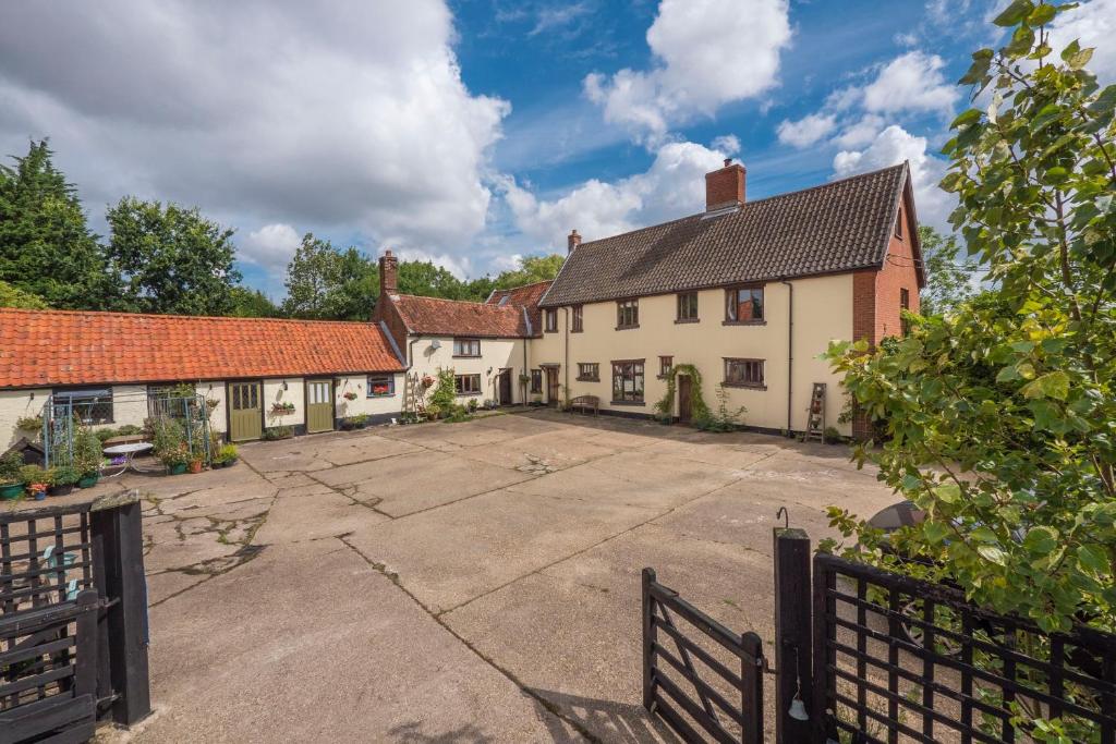 an empty parking lot in front of a house at Valley Farmhouse B&B in Southwold