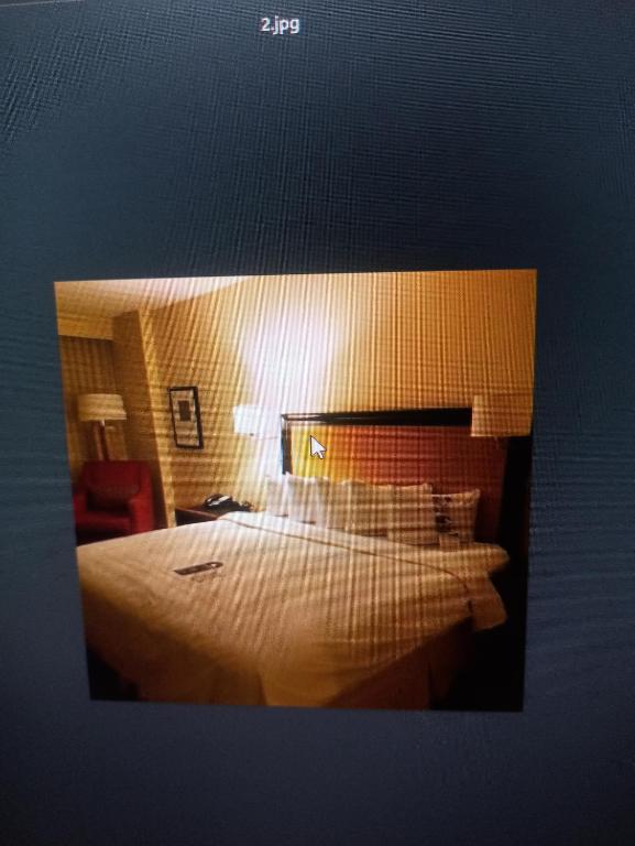 a hotel room with a large bed with white pillows at Shri ji hotel in Govardhan