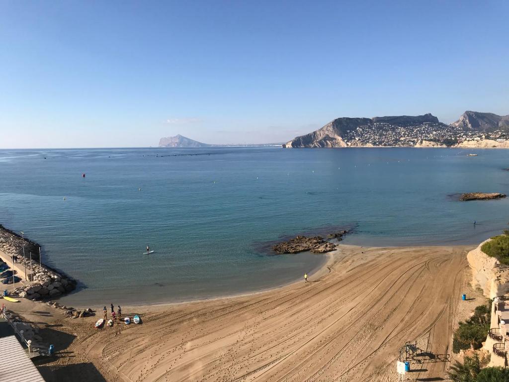 a view of a beach with people on the sand at Ti Miquel in Ifach