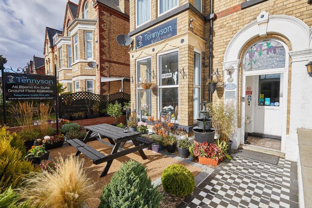 a store with a picnic table outside of it at The Tennyson in Bridlington