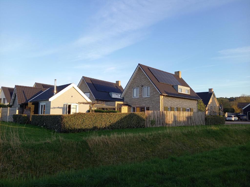 a row of houses in a residential neighborhood at Room by the sea in Zoutelande