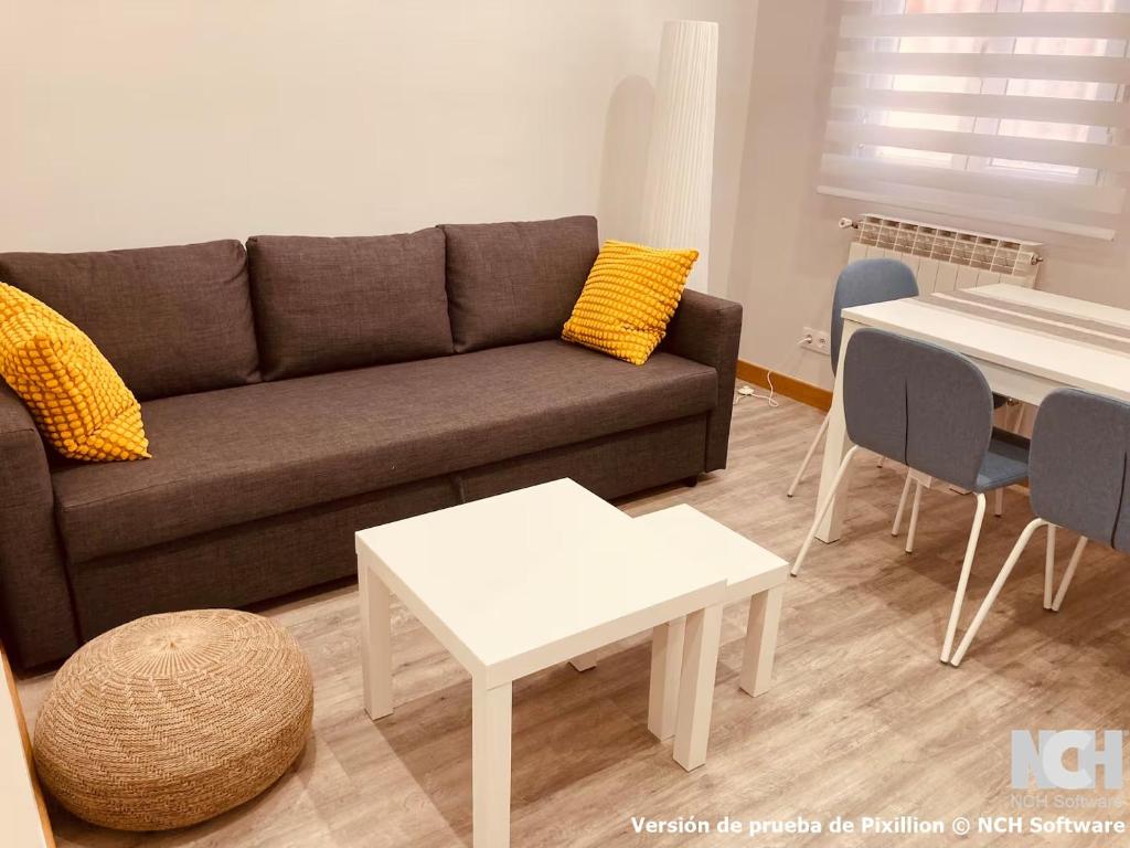 a living room with a couch and a table at San Gregorio 2 in Soria