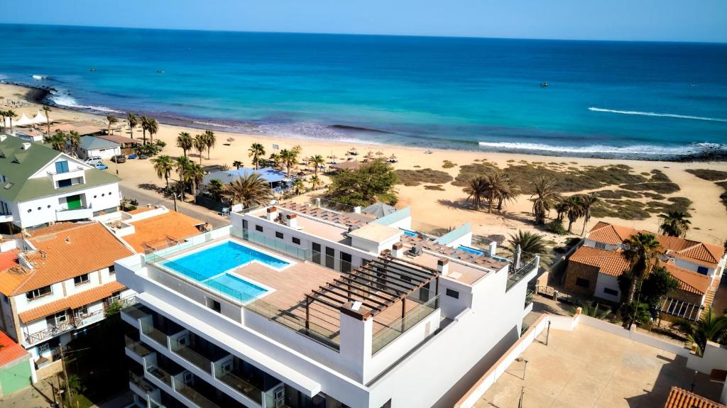 an aerial view of a hotel and the beach at Edificio Lux's - Apartamentos Tubarão in Santa Maria