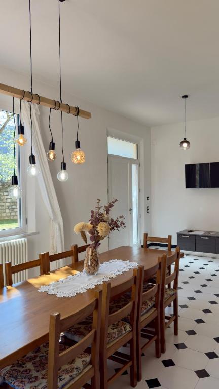 a dining room with a wooden table and chairs at Appartamento Le Crugnole in Montepulciano