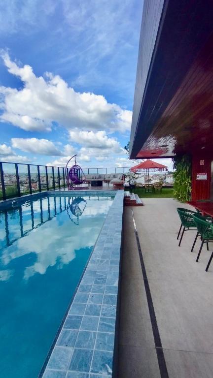 a swimming pool on the roof of a building at Flat Exclusivo com Rooftop e Piscina in Campina Grande