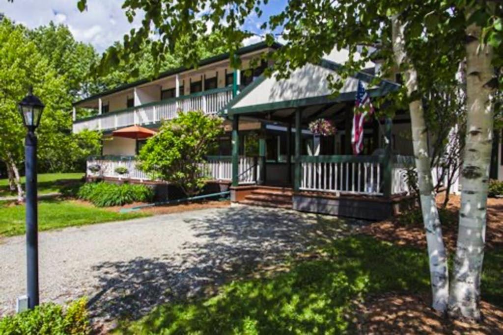 a house with a flag in front of it at Seasons 207 in Warren