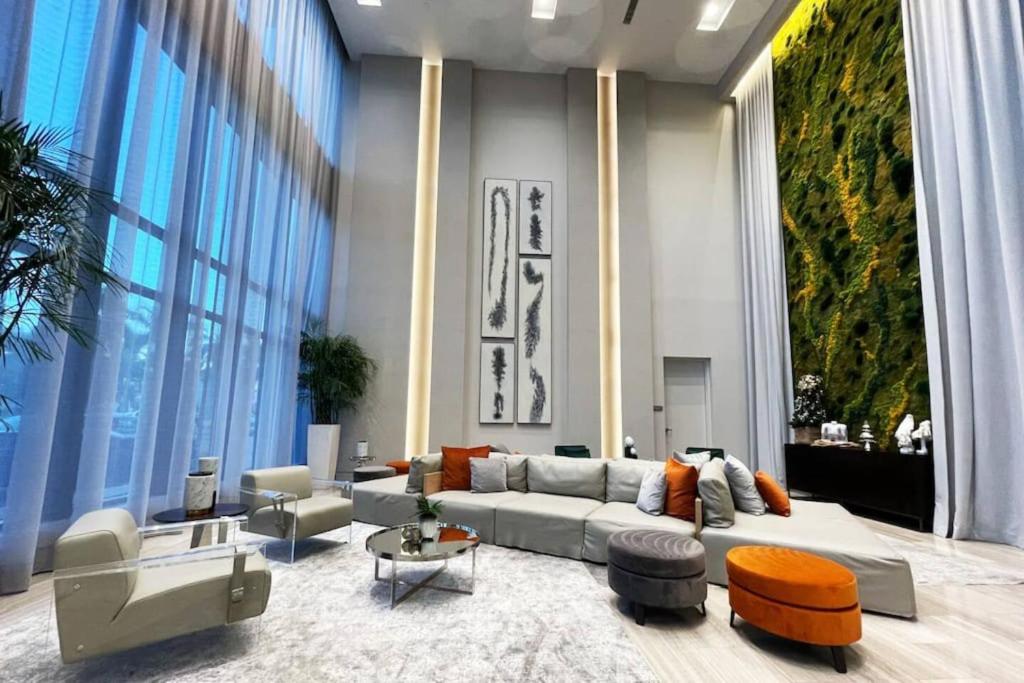 a large living room with a couch and chairs at Luxury Condo - 3B3B with Amazing Skyline View in Miami