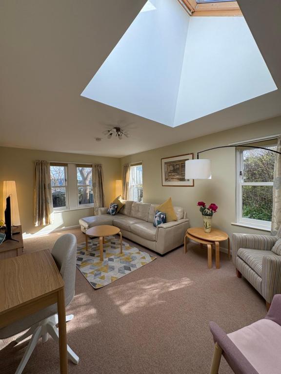 a large living room with a large skylight at The Rookery in Orkney