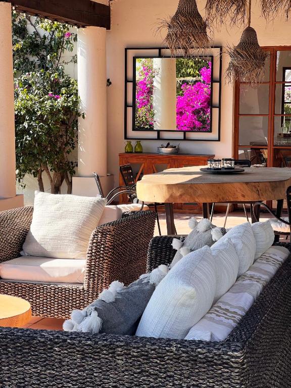 a living room with a couch and a table at Tierra Alta Boho House in San Miguel de Allende