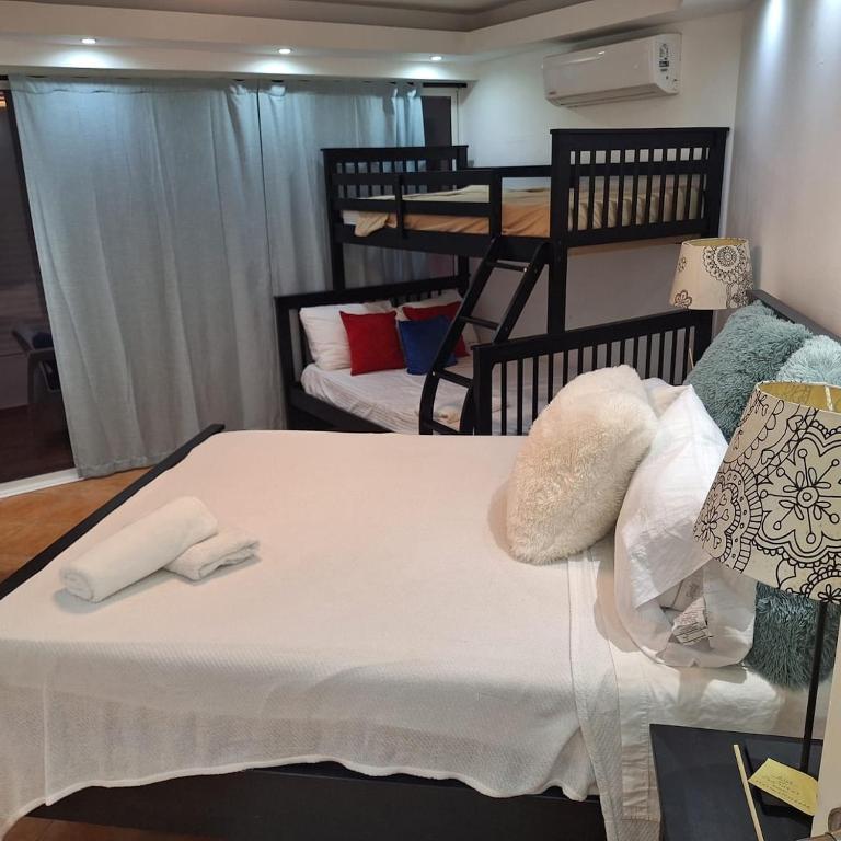 a bedroom with two beds with pillows on it at Urbanutopia Apartment A109 in Villas del Mar