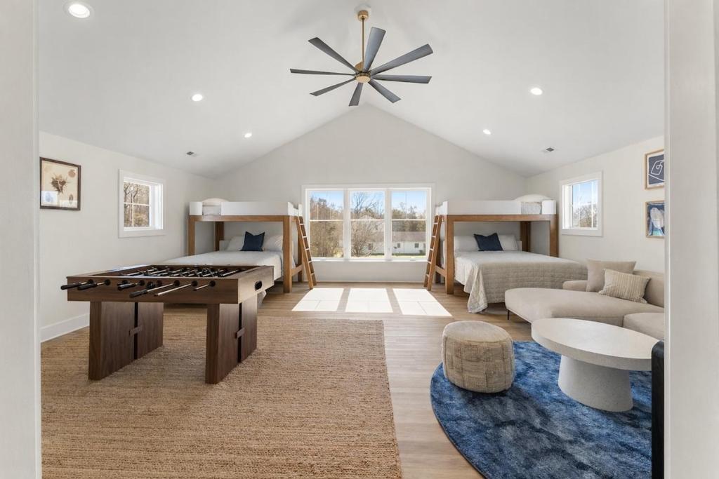 a living room with two beds and a table at Bay Dreaming in Montross