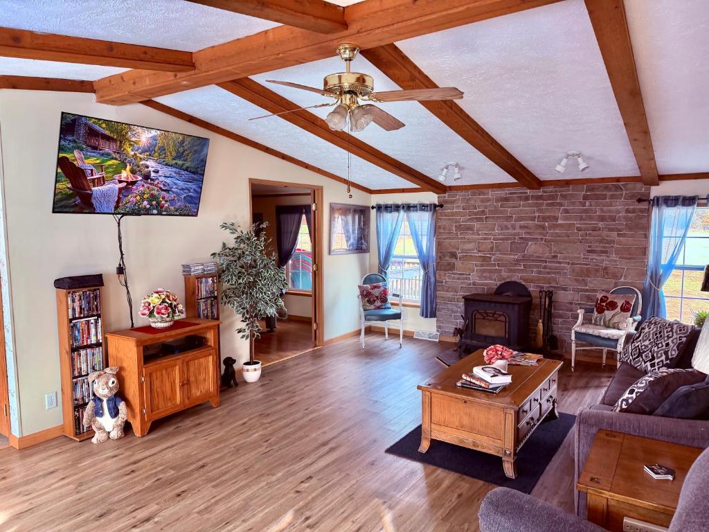 a living room with a couch and a ceiling at 15 miles to Windham Mountain ! King Bed, Game Room, OutDoor Patio in Cairo