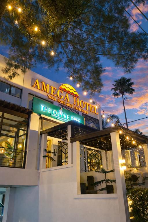 a building with a sign that reads america hotel at Amega Hotel in Tagaytay