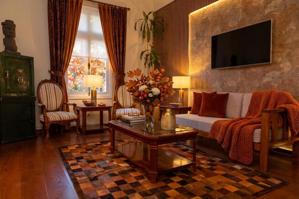 a living room with a couch and a table at H Ocaranza in Santiago