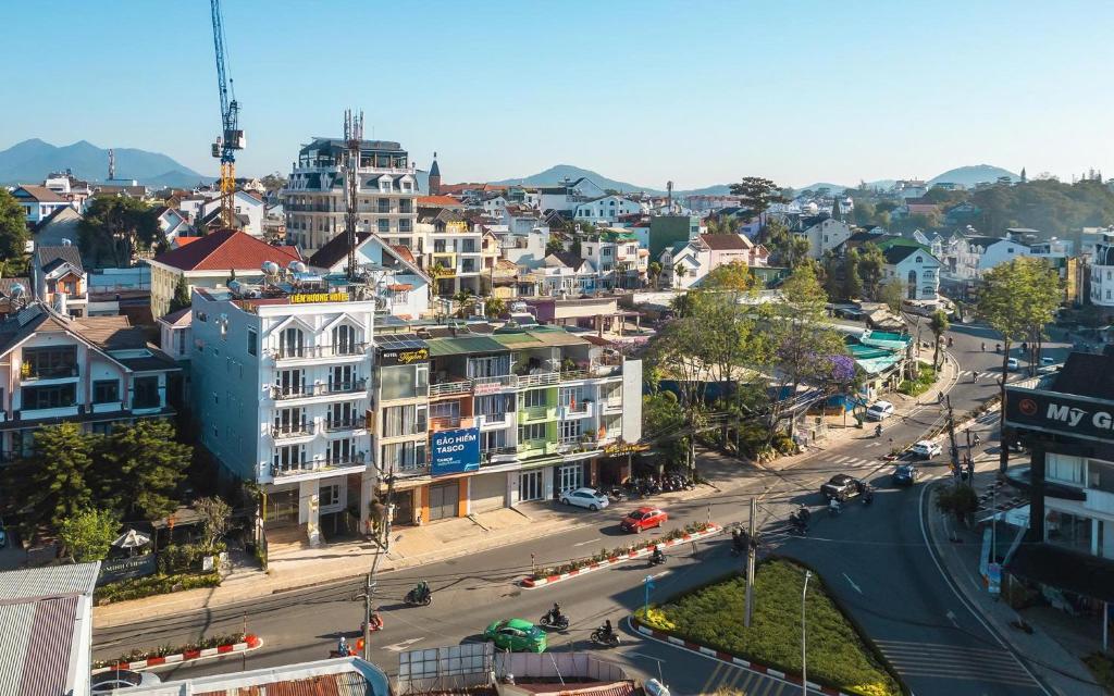 an aerial view of a city with buildings and a street at Liên Hương Hotel Đà Lạt in Kon Rung (1)