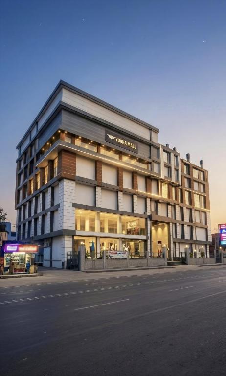 a building on a street in front of a building at The Royal Height in Nawāda