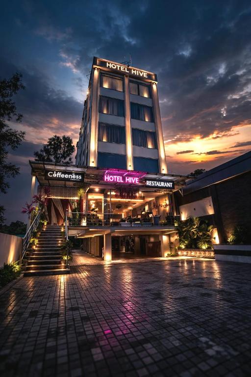 a hotel with a sign that reads hotel time at HOTEL HIVE in Mājra