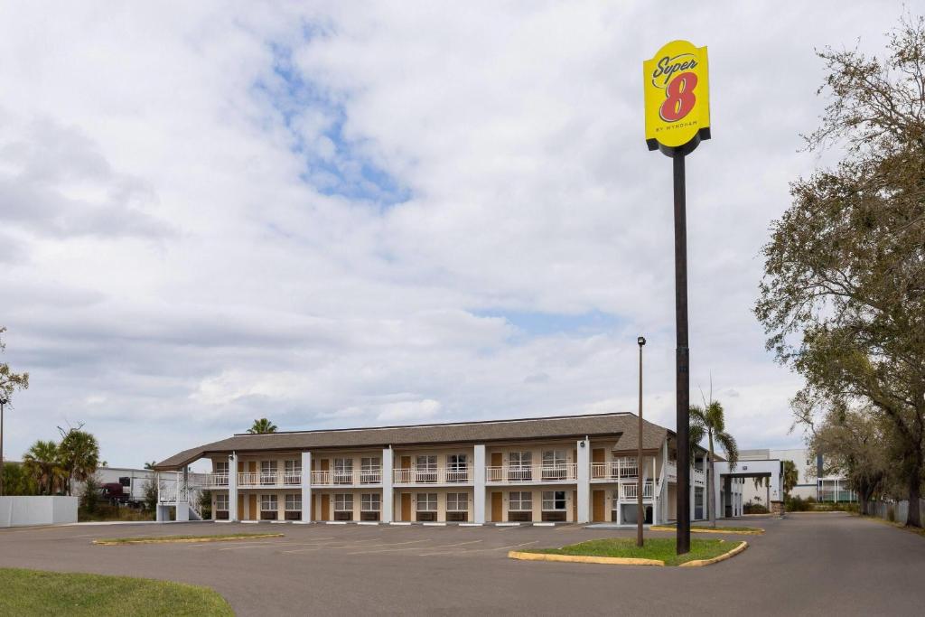 a building with a sign in front of it at Super 8 by Wyndham Ellenton Bradenton Area in Ellenton