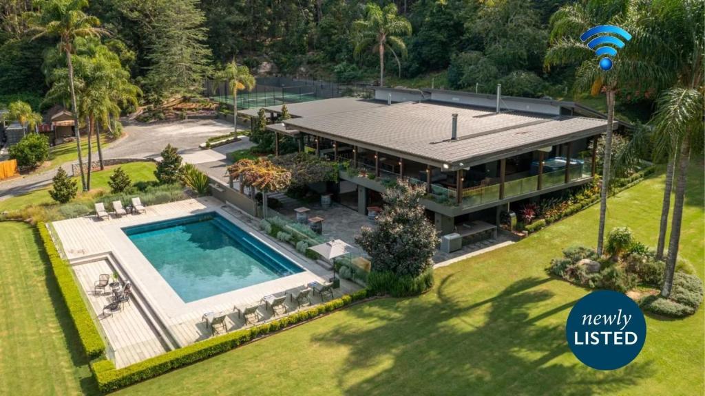 an aerial view of a house with a swimming pool at Grants - West Cambewarra, Longreach in West Cambewarra