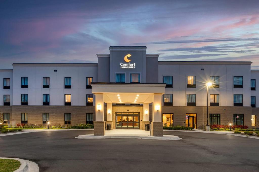 a large white building with a sign on it at Comfort Inn & Suites Clarkston Pine Knob Area in Clarkston