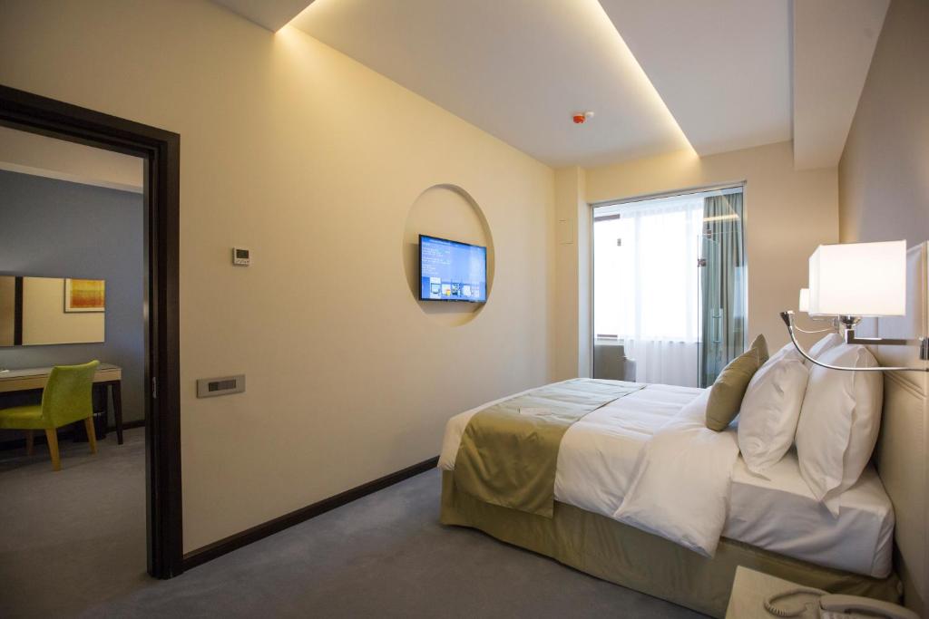 Postel nebo postele na pokoji v ubytování Ararat Resort Tsaghkadzor