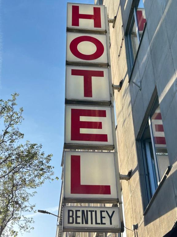 a sign on the side of a building at Hotel Bentley in Brussels