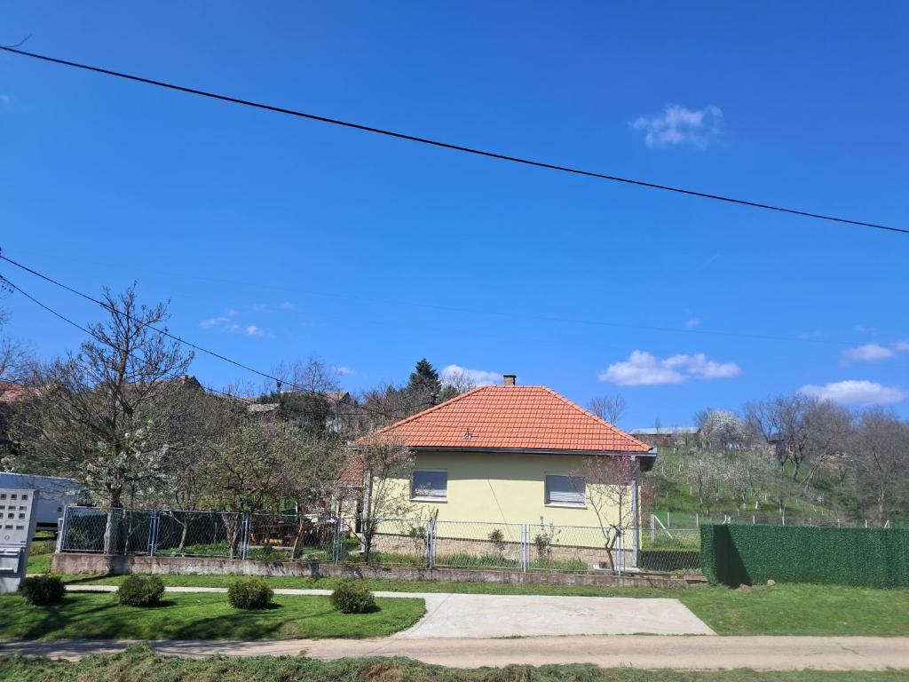 a yellow house with an orange roof at Miris prirode in Vrdnik