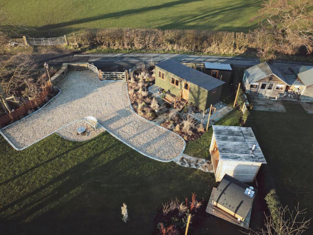 an aerial view of a house with a yard at Bailey Huts in Litton