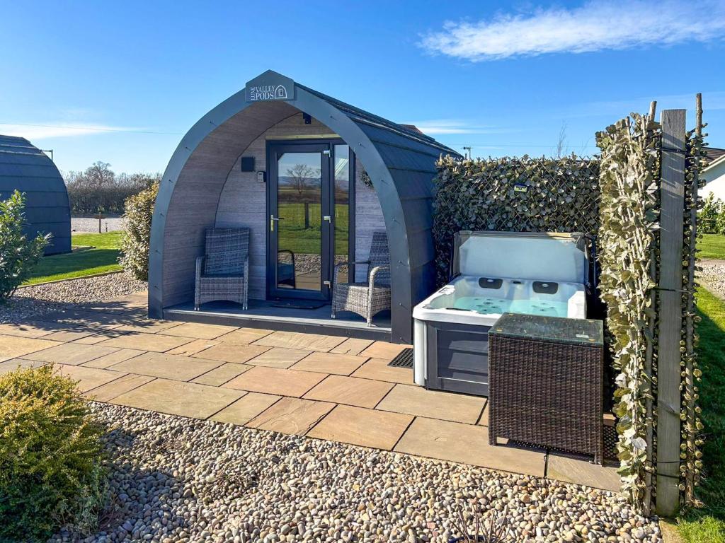 a gazebo with a stove in a yard at The Rounton - Ukc9284 in Brompton