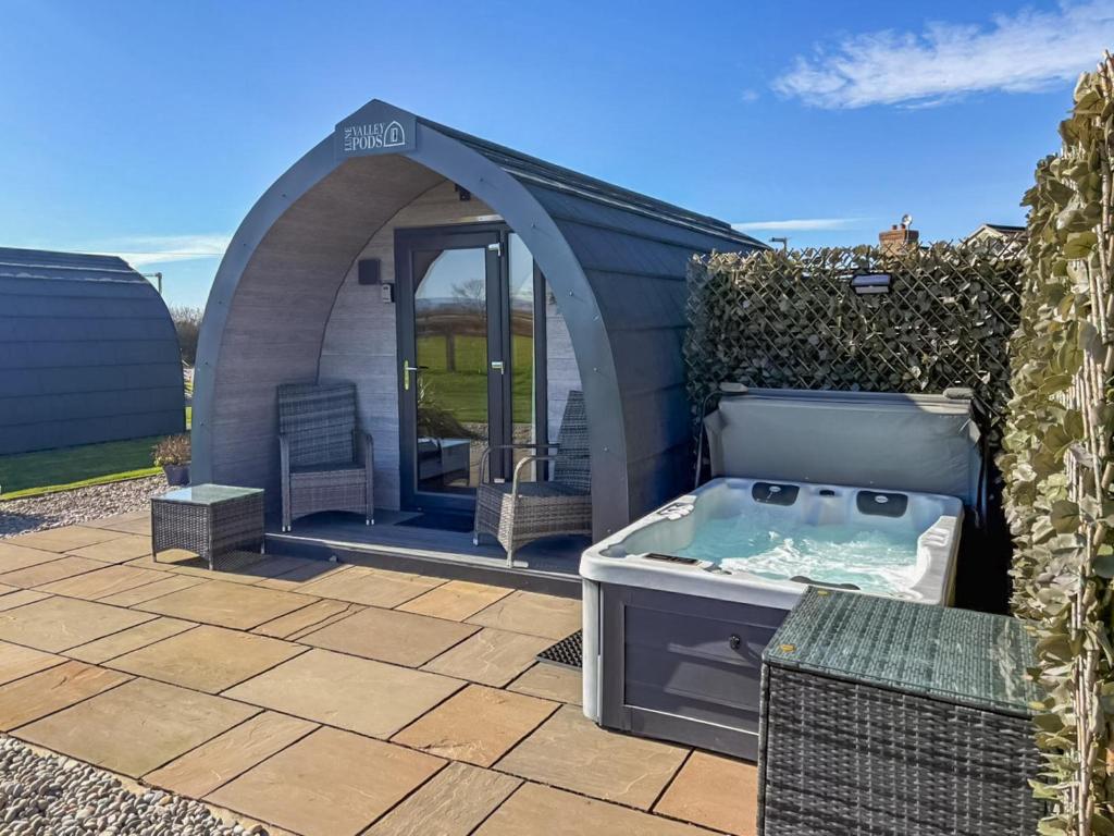 a gazebo with a hot tub in a yard at The Welbury - Ukc9285 in Brompton