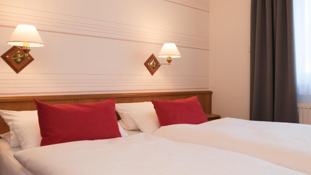 Postel nebo postele na pokoji v ubytování Hotel Zum Bären