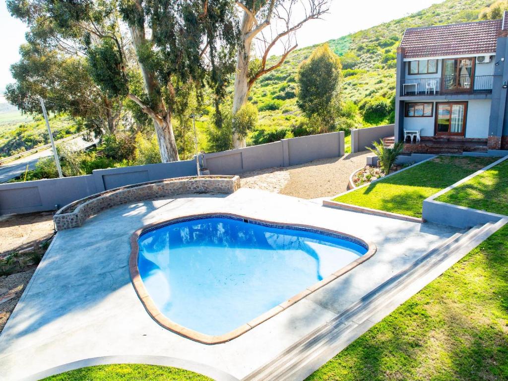 a swimming pool in the yard of a house at Piketberg Guesthouse in Piketberg