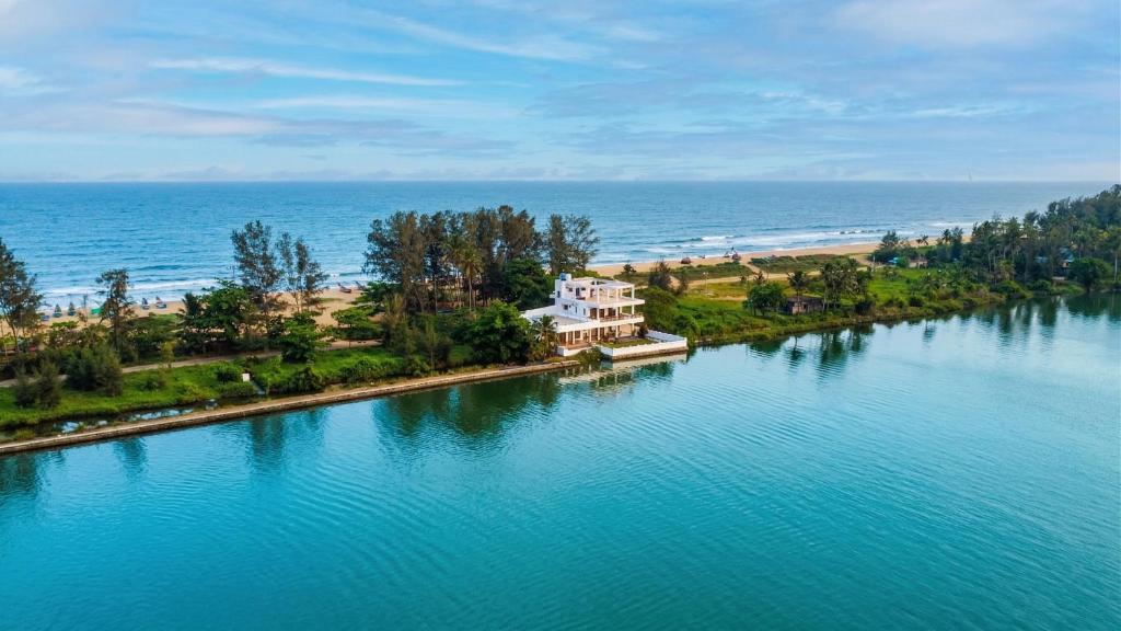 an aerial view of a house in the middle of a lake at Willostays Tamarind beach villa in Cherai Beach