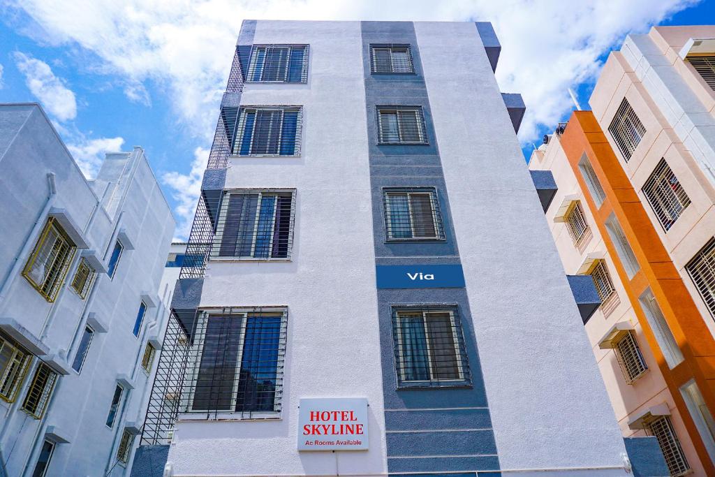 a tall building with a sign in front of it at Via Skyline I in Méribel Village